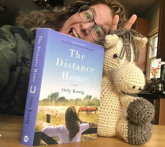 Orly Konig with The Distance Home and a crocheted horse